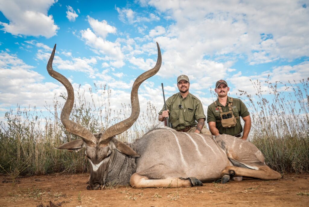 Two hunters with a kudu bull taken on a Kaiwhai Safaris hunt
